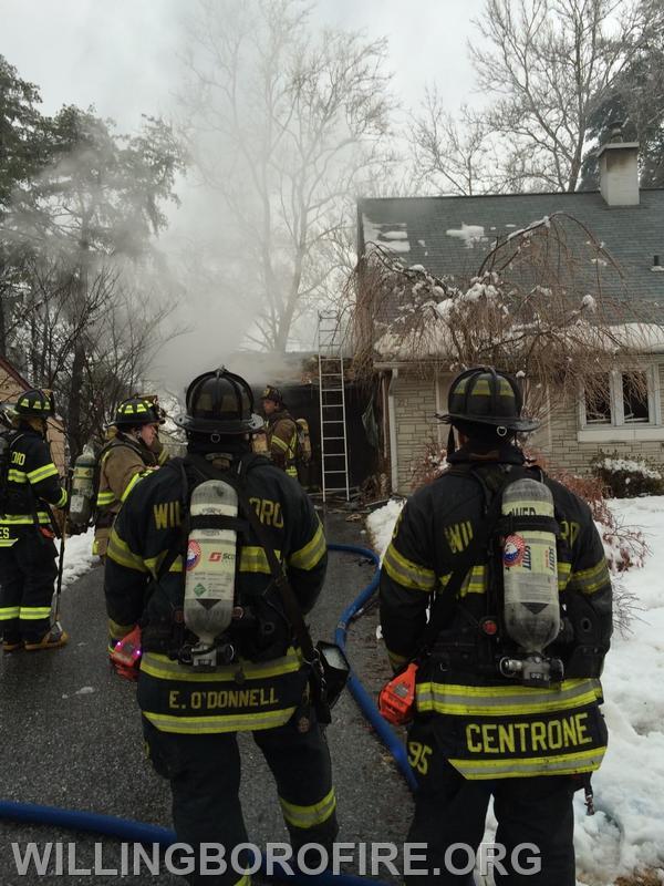 Firefighters E. O'Donnell and Centrone on a house fire.