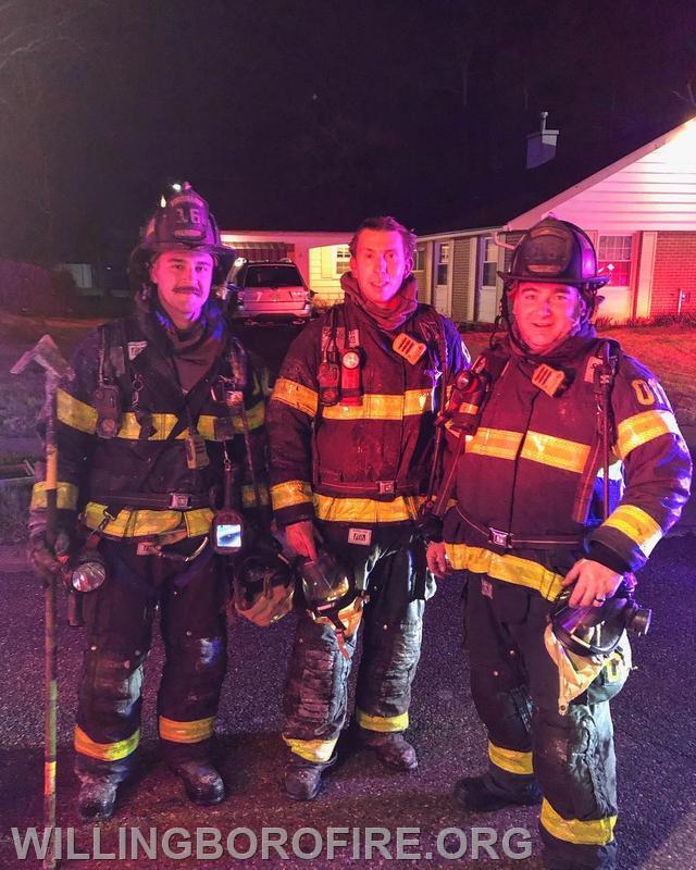 Firefighters Connelly, Barger, and Clark after a fire.