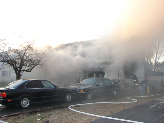 Heavy smoke issuing from a house fire in Somerset Park