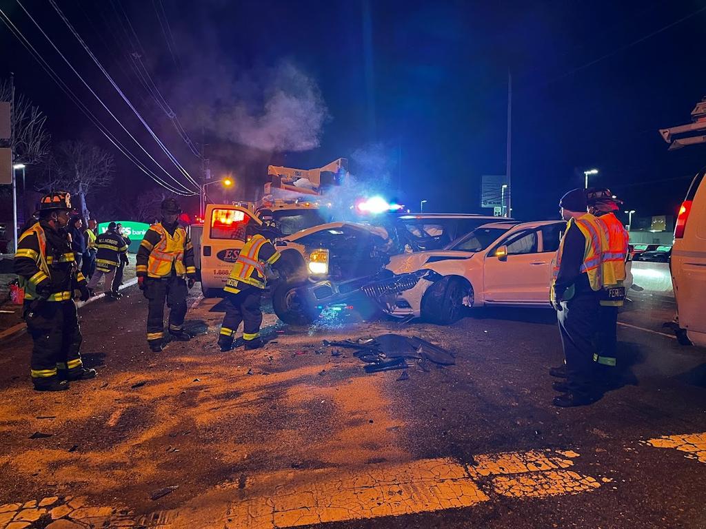 Firefighters applying oil dry to the ground following a 5 car motor vehicle accident on Route 130.