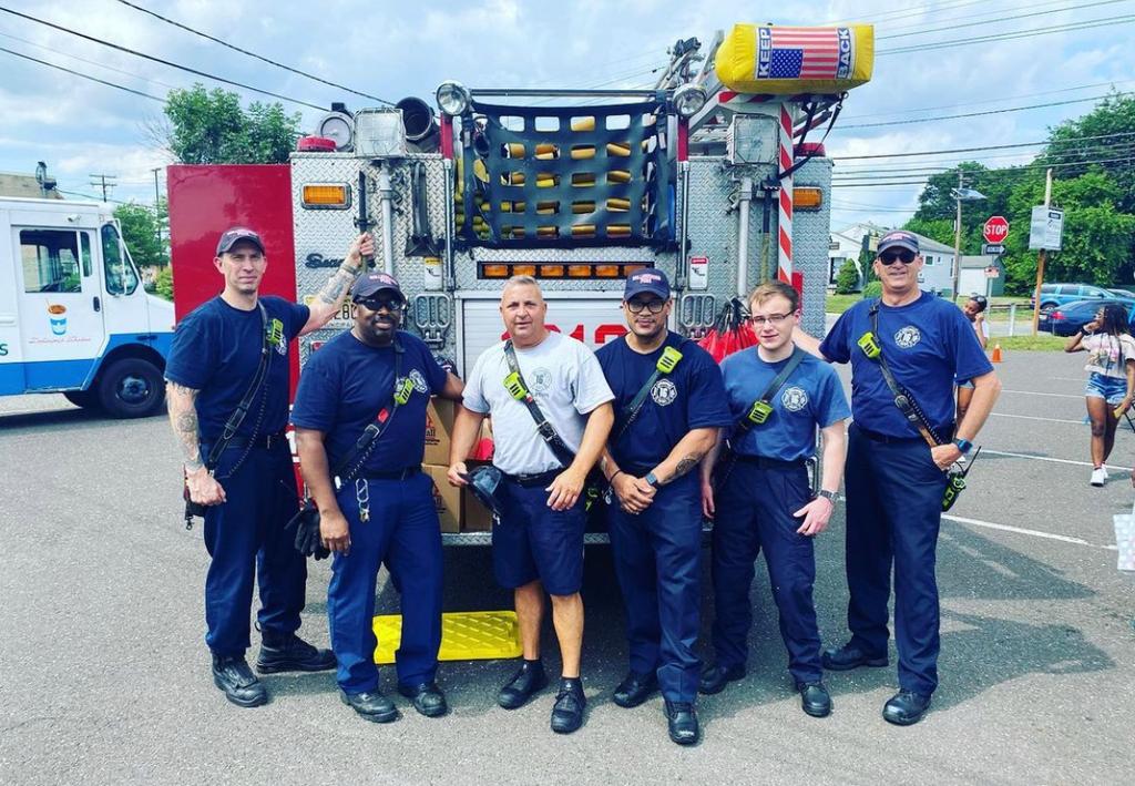 Firefighters Barger, Bennett, Captain Fresco, Firefighters Child, McCorkle, and Anderson at a community event.