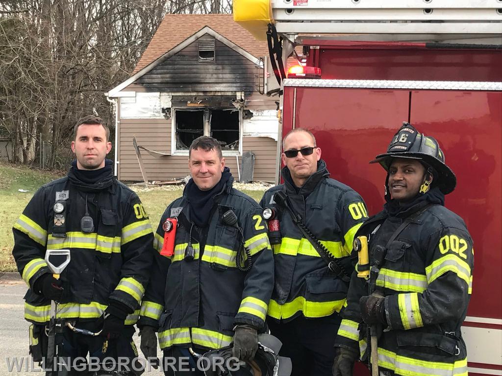 Firefighter Riley, Lieutenant Costello, Firefighters Anderson, and Bowe after a fire.