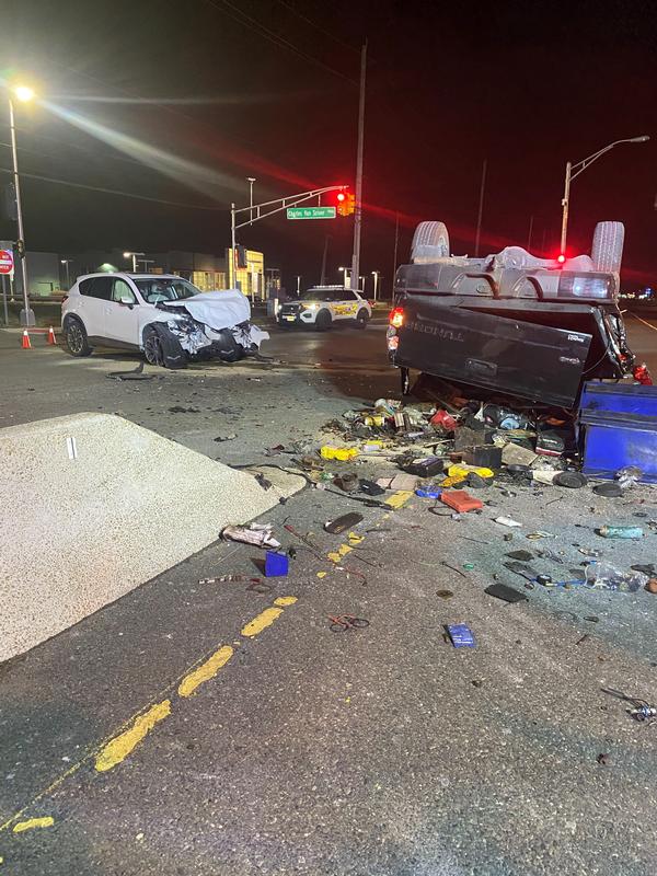 Firefighters on scene of a two vehicle accident with one overturned on Route 130