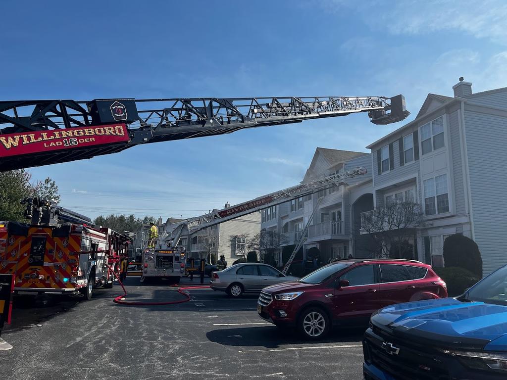 Ladder 1615 set up to the roof at a fire in Delran.