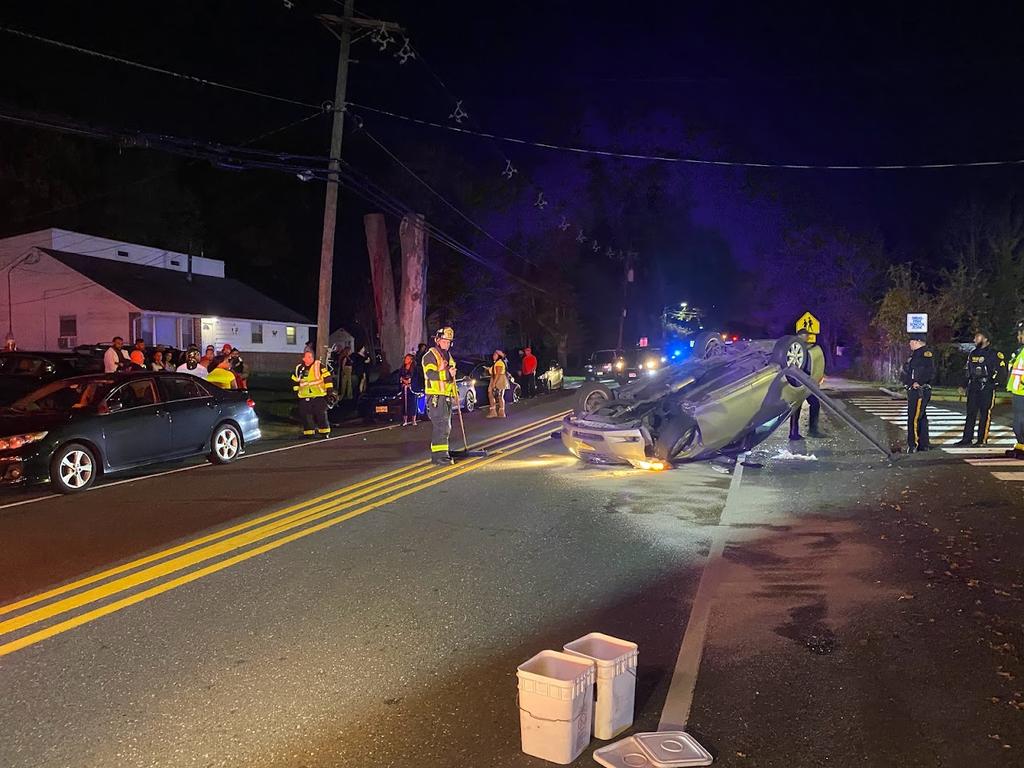 Crews on scene of an overturned vehicle on JFK Way.