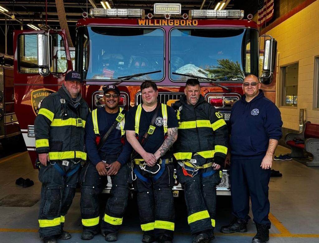 Lieutenant O'Donnell, firefighters Child, Nardi, Robertson, and Clark in front of 1613 after an all-hands fire on Thanksgiving.