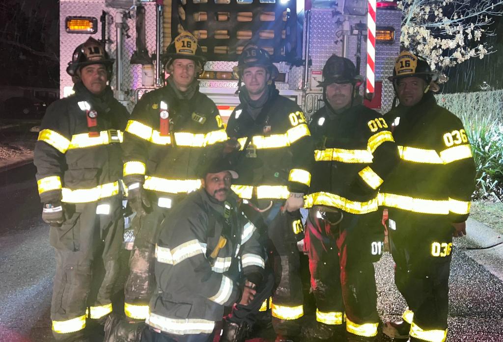 Lieutenant Ferrell, Firefighters Levins, Bowe, Connelly, LeHuquet, and Quarles after a fire.