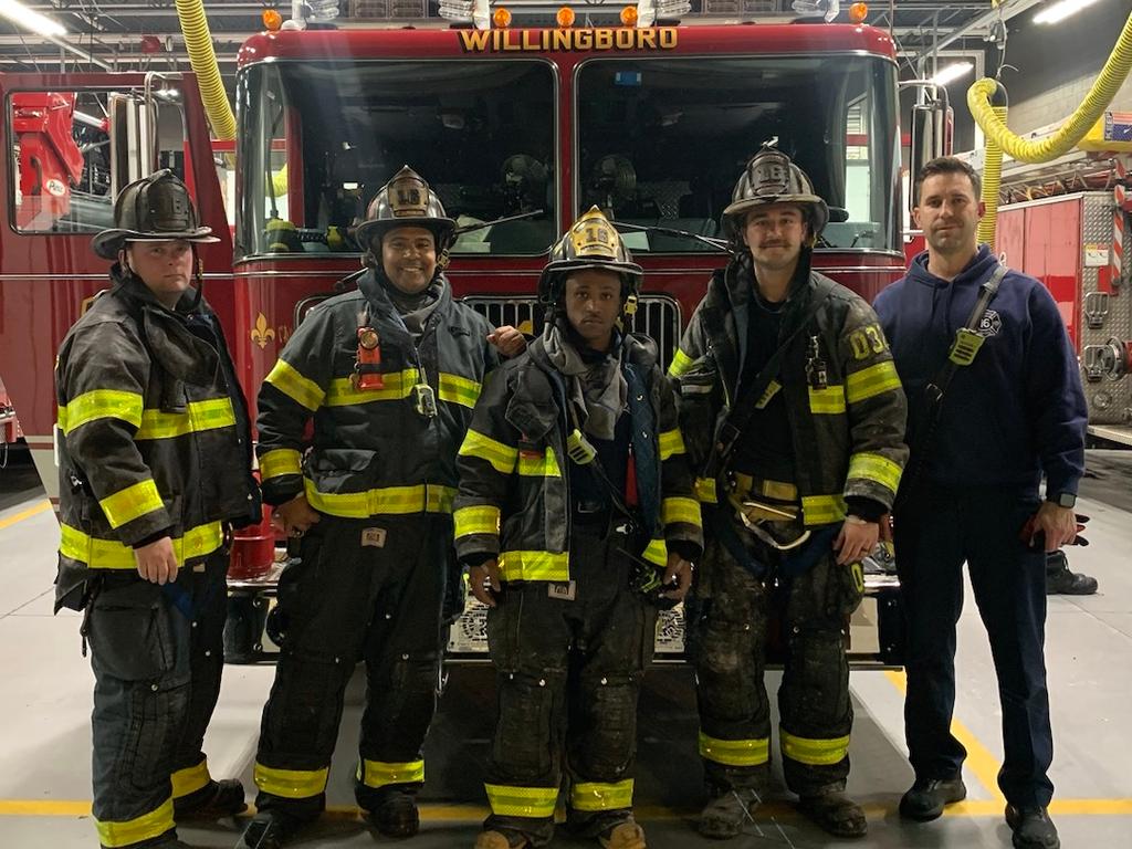 Firefighter Lehuquet, Lieutenant Ferrell, firefighters Dawson, Connelly, and Riley after returning from an all-hands apartment fire in Edgewater Park.