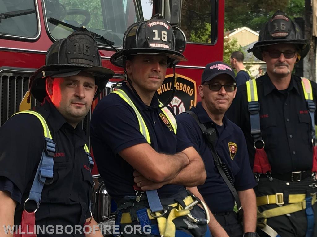 Firefighters Rydarowski, Priest, Anderson, and Watkins after a fire.