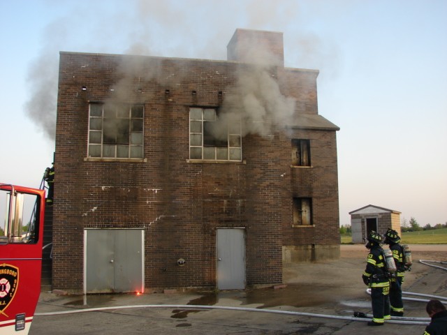 Smoke coming from the windows of the burn building