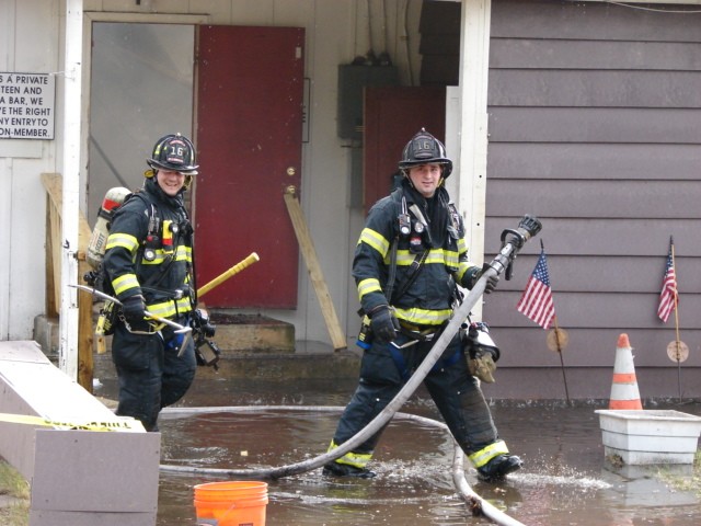 Firefighters Carcasio and Rydarowski (l to r) during a fire at the VFW Post