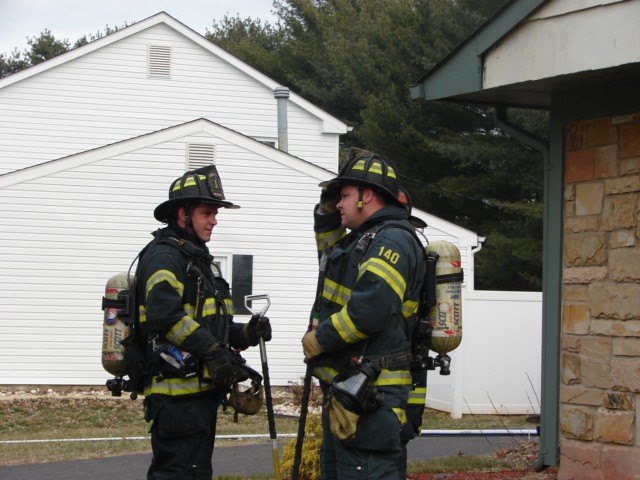 Firefighters Costello (l) and O'Donnell (r) after a house fire in Twin Hills Park