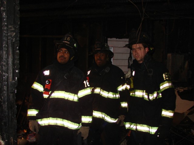 Firefighters Ferrell, Bennett, and Carty (l to r) after a house fire on Parkside Circle