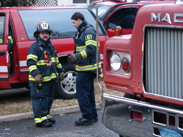 Captain Ramsey (l) and Firefighter Rydarowski (r) after a house fire on Parkside Circle