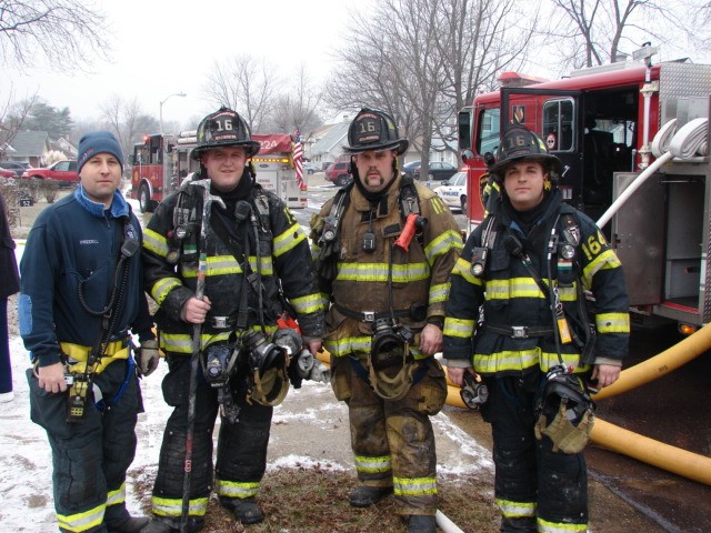 Firefighters Friddell, E. O'Donnell, Robertson, and Fresco (l to r) after a house fire on Maplewick Lane