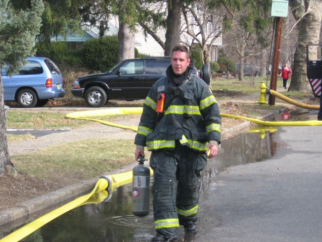 Firefighter Reed Costello after a house fire in Beverly