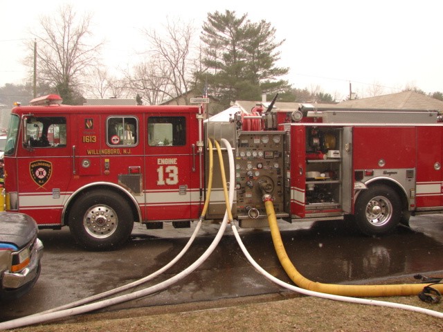 Engine 1613 with all hose lines off at a house fire on Hadley Lane